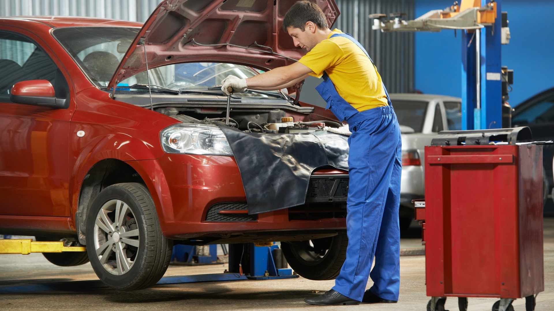 auto mechanic at work with wrench